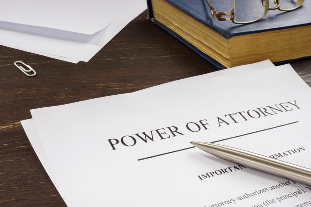 Power of attorney POA legal document and pen. Powers of Attorney at Wheeler Upham, Grand Rapids, Michigan